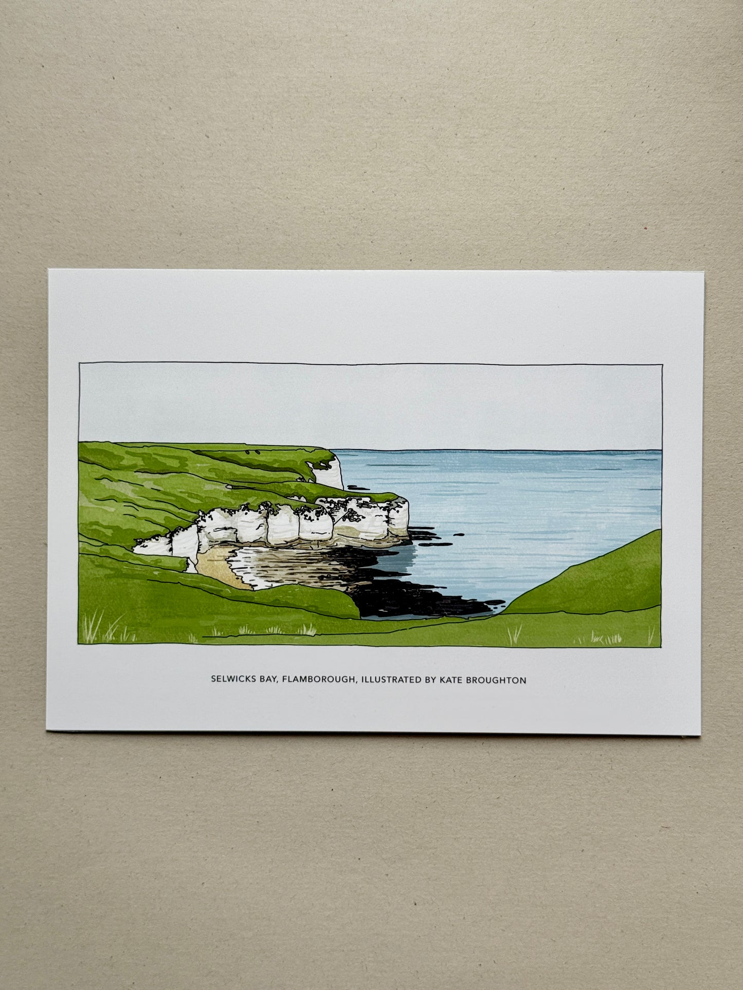 Illustration of a Flamborough Selwicks Bay coastal scene with cliffs and sea.