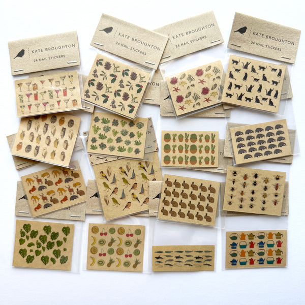 collection of nail art stickers of different designs - christmas, animals, plants, cats, birds, bees
