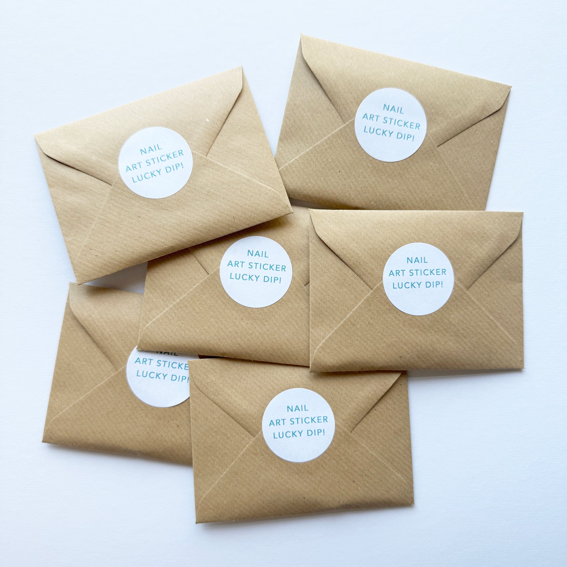 Five brown envelopes with white labels on a white background
