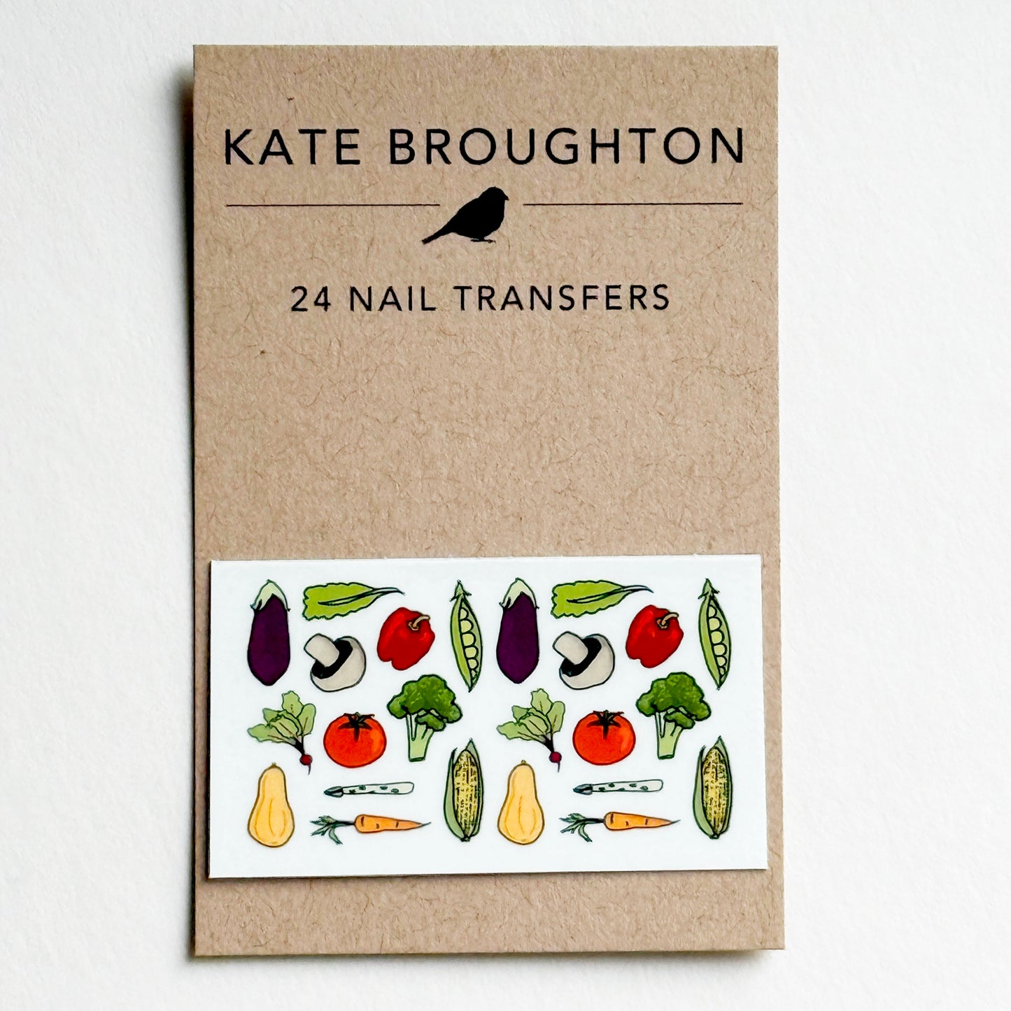Kate Broughton nail transfer recycled packaging with vegetable illustrations on a white background